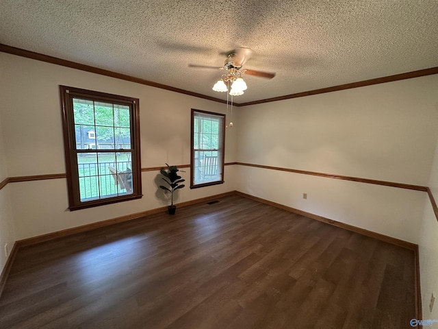 2008 Oakleaf Ln, Arab, AL 35016 - spare room with ornamental molding, dark wood-style flooring, baseboards, a textured ceiling, and a ceiling fan