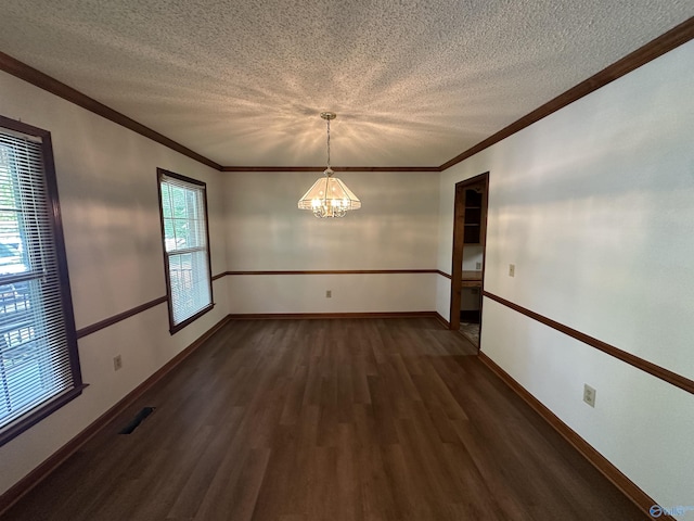 2008 Oakleaf Ln, Arab, AL 35016 - empty room with crown molding, baseboards, a textured ceiling, a chandelier, and dark wood finished floors