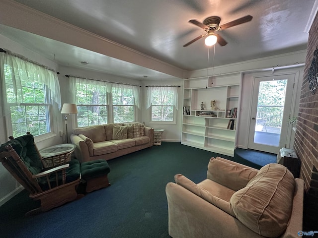 2008 Oakleaf Ln, Arab, AL 35016 - living room featuring a ceiling fan, baseboards, ornamental molding, and dark carpet
