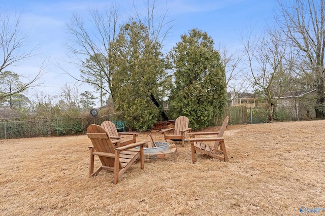 view of yard with an outdoor fire pit