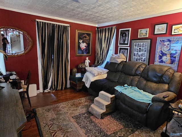 living area featuring ornamental molding, wood finished floors, and a textured ceiling