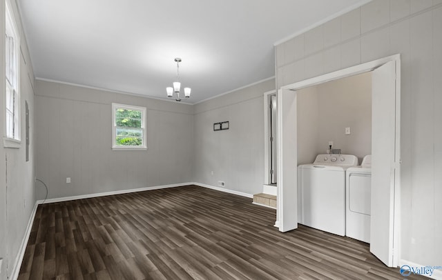 washroom featuring a chandelier, ornamental molding, independent washer and dryer, and dark wood-type flooring