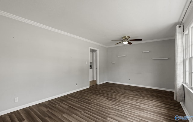 empty room with ceiling fan, crown molding, and dark wood-type flooring