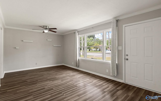 entryway with a textured ceiling, dark hardwood / wood-style floors, ceiling fan, and ornamental molding