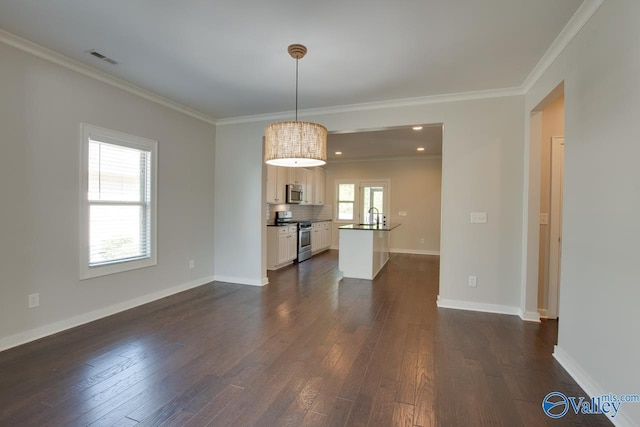 interior space featuring dark wood-type flooring, visible vents, and ornamental molding