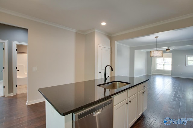 kitchen with dishwasher, dark countertops, a sink, and dark wood-style floors