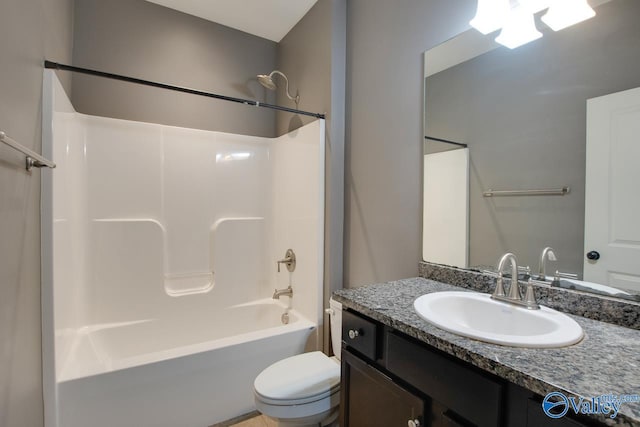 full bathroom featuring toilet, vanity, and shower / washtub combination
