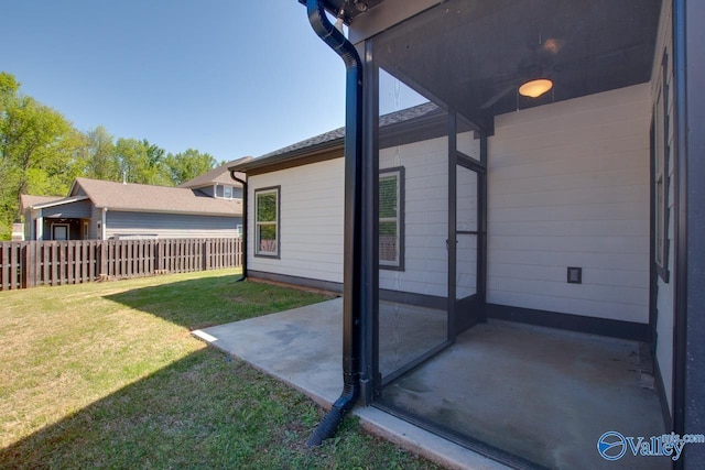 view of yard featuring fence and a patio