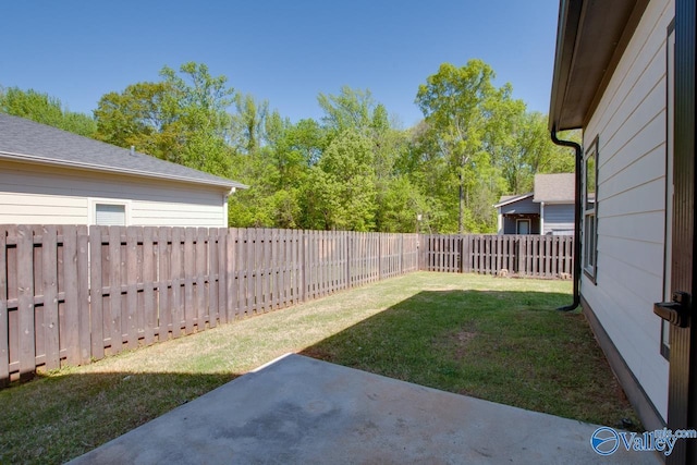 view of yard featuring a patio area and a fenced backyard