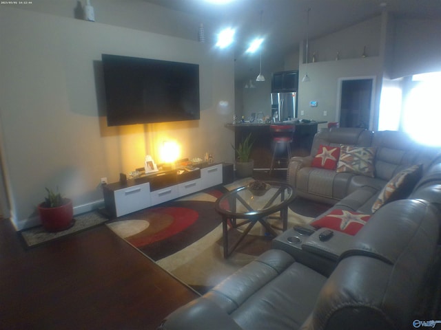 living room featuring vaulted ceiling