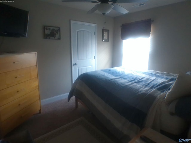 carpeted bedroom featuring ceiling fan