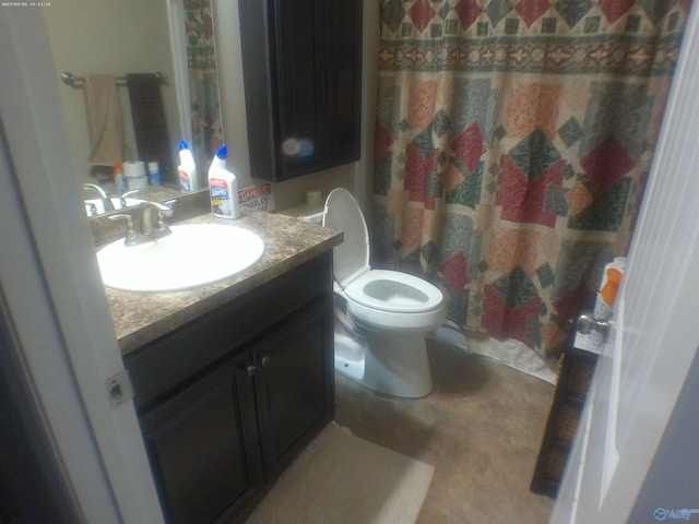 bathroom featuring vanity, toilet, and curtained shower