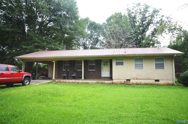 single story home with a carport and a front yard