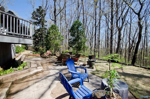 view of patio / terrace with a fire pit and outdoor dining space