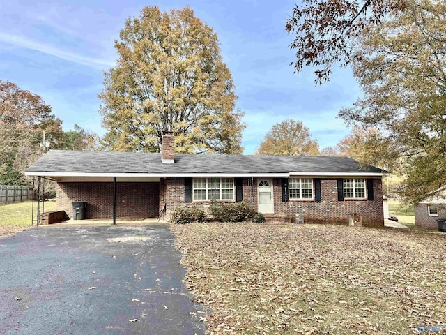 ranch-style house with a carport