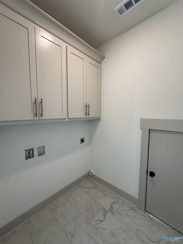 laundry room with hookup for an electric dryer, baseboards, visible vents, cabinet space, and marble finish floor