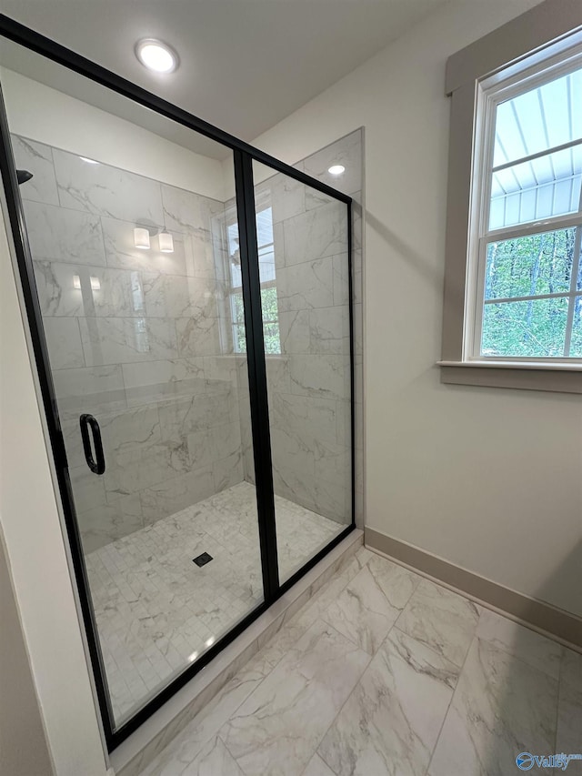 bathroom with baseboards, recessed lighting, marble finish floor, and a stall shower