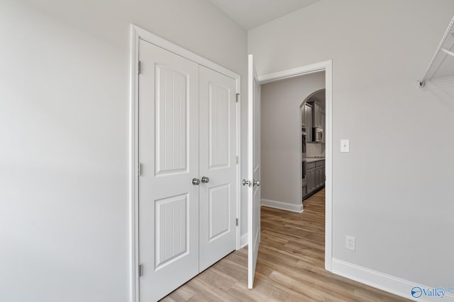 hall with light hardwood / wood-style floors