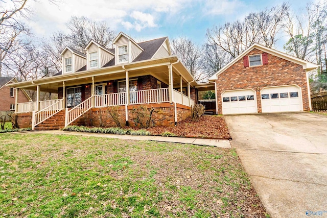 view of front of property featuring a garage, covered porch, and a front lawn