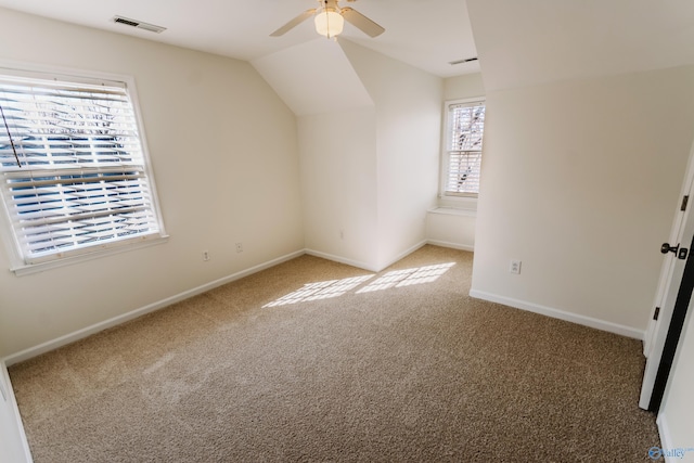 bonus room featuring vaulted ceiling, ceiling fan, and carpet