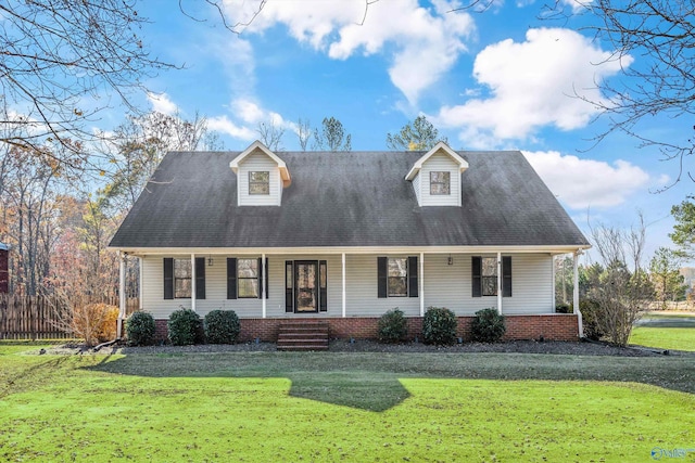 cape cod house with a porch and a front lawn