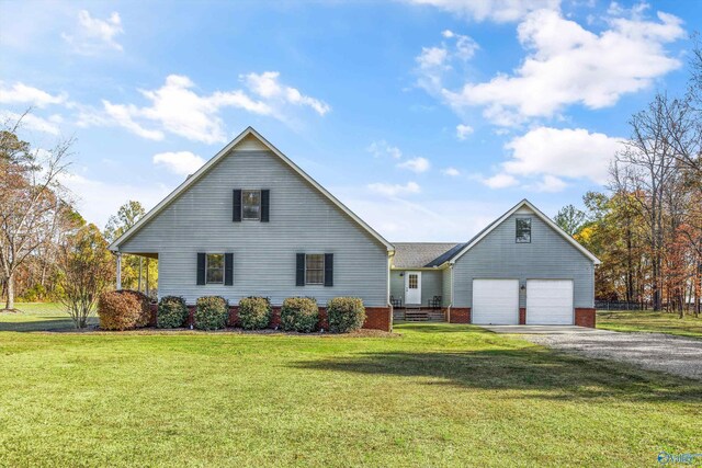 view of front of property featuring a garage and a front yard