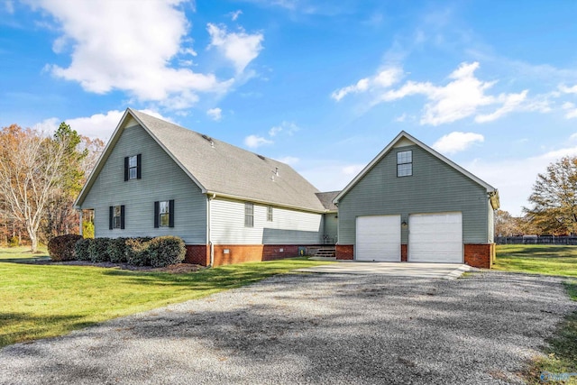 view of property exterior featuring a lawn and a garage