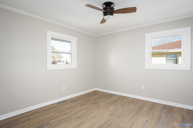 spare room with ceiling fan, ornamental molding, and hardwood / wood-style floors