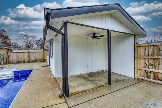 exterior space featuring ceiling fan and a pool