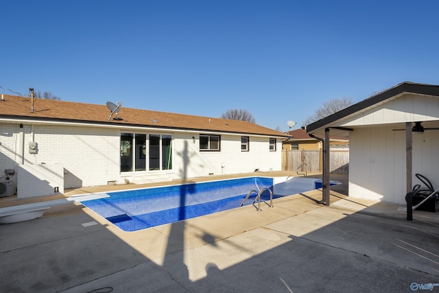 view of pool with ceiling fan and a patio