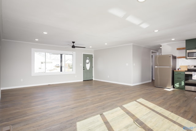 unfurnished living room featuring ceiling fan, ornamental molding, and hardwood / wood-style floors