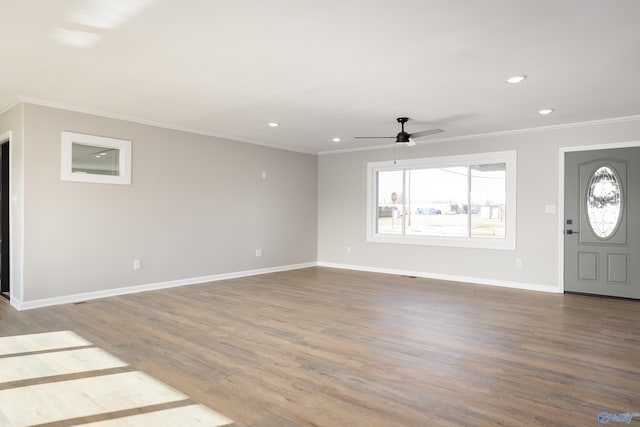 entryway with ceiling fan, ornamental molding, and hardwood / wood-style floors