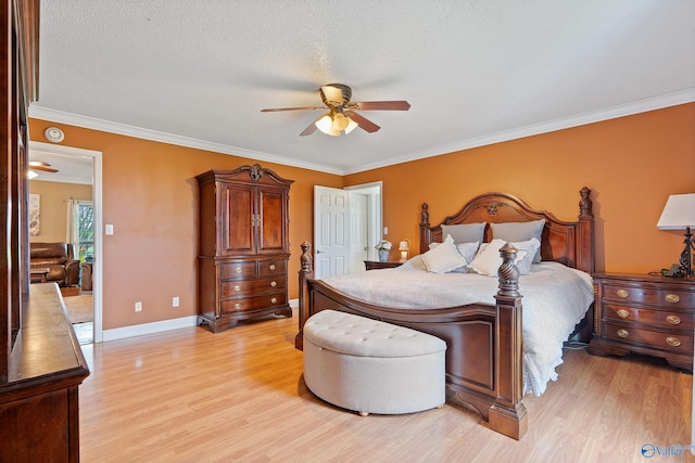 bedroom featuring crown molding, ceiling fan, light wood-style floors, a textured ceiling, and baseboards