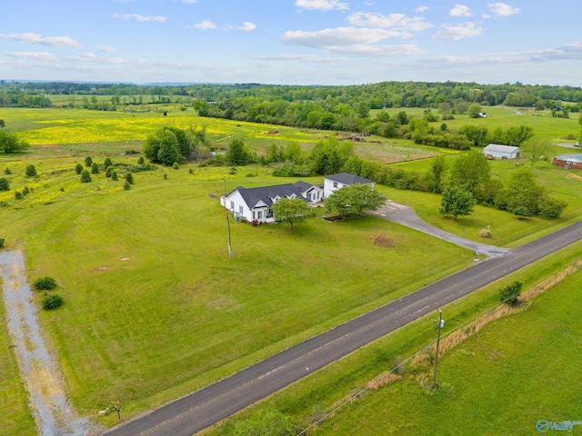 birds eye view of property with a rural view