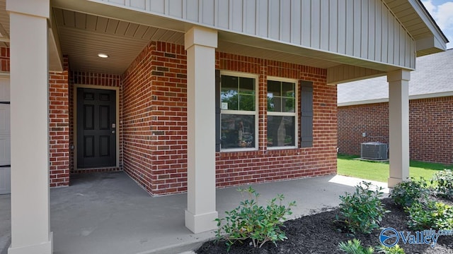 entrance to property with brick siding and board and batten siding