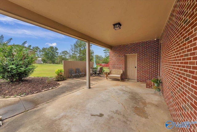 view of patio featuring fence