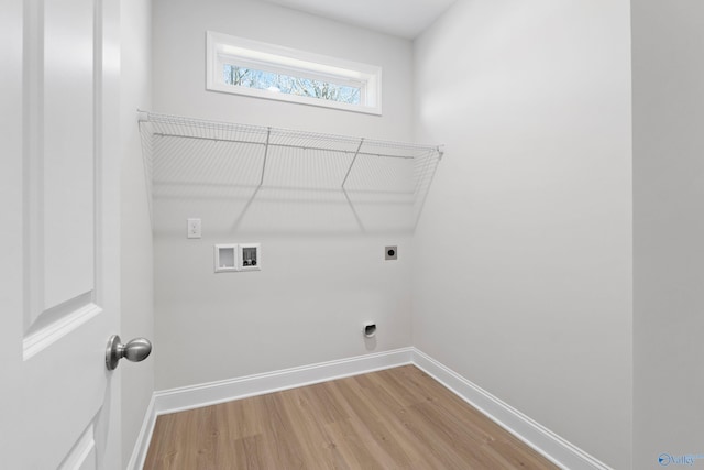 2159 Dawson Ln NE, Cullman, AL 35058 - washroom featuring laundry area, baseboards, hookup for a washing machine, light wood-style flooring, and hookup for an electric dryer