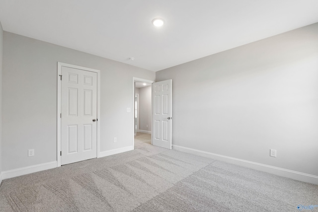2159 Dawson Ln NE, Cullman, AL 35058 - unfurnished bedroom featuring baseboards and light carpet