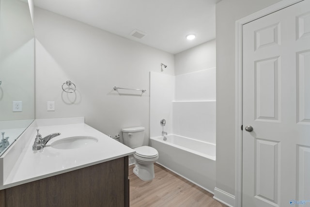 2159 Dawson Ln NE, Cullman, AL 35058 - full bathroom with shower / bathing tub combination, visible vents, wood finished floors, vanity, and toilet