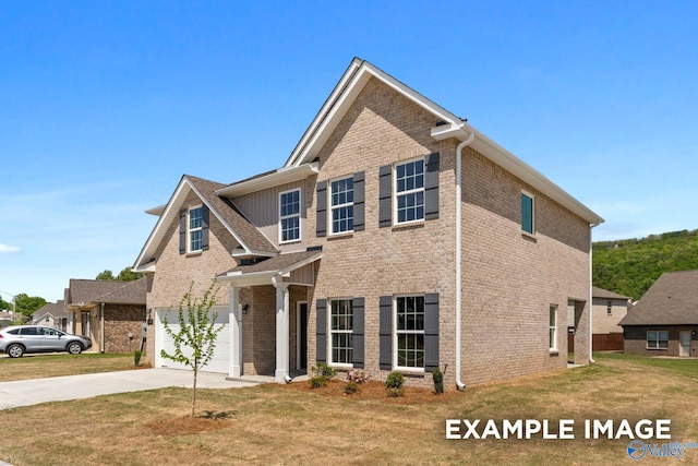 view of front of home with a garage, a front yard, concrete driveway, and brick siding