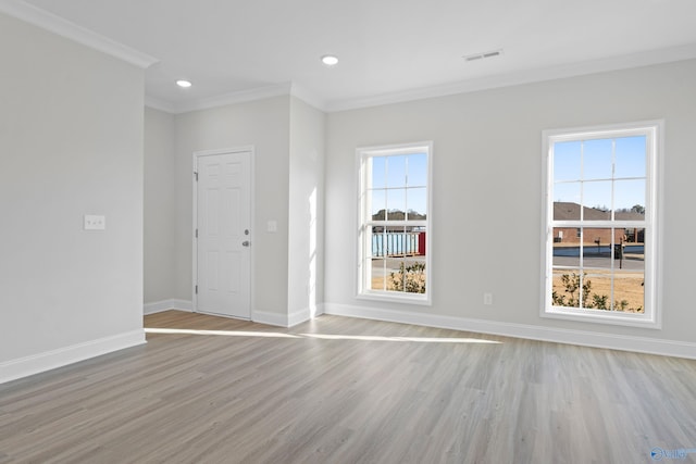 2159 Dawson Ln NE, Cullman, AL 35058 - empty room with visible vents, baseboards, light wood finished floors, ornamental molding, and recessed lighting