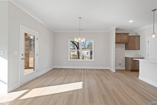 2159 Dawson Ln NE, Cullman, AL 35058 - unfurnished dining area featuring ornamental molding, light wood-style floors, baseboards, recessed lighting, and a chandelier