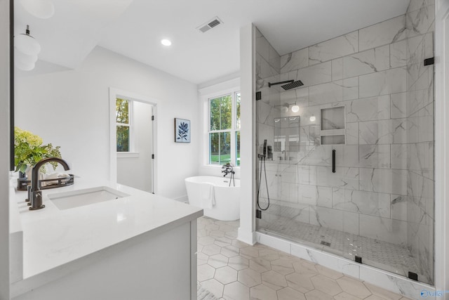 bathroom with vanity, separate shower and tub, and tile patterned floors