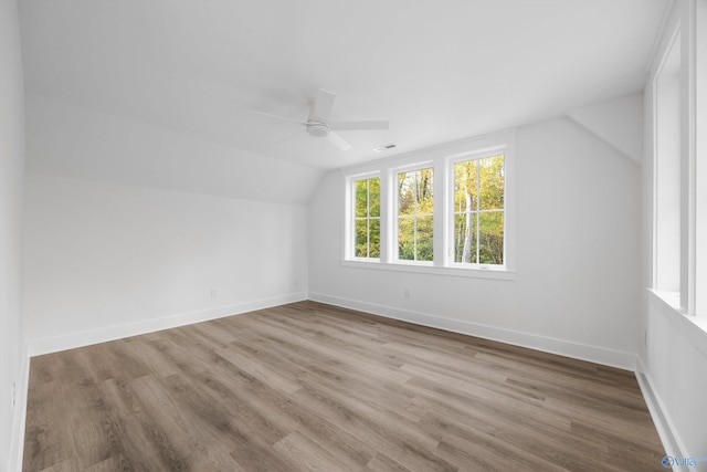 bonus room with ceiling fan, light wood-type flooring, and vaulted ceiling