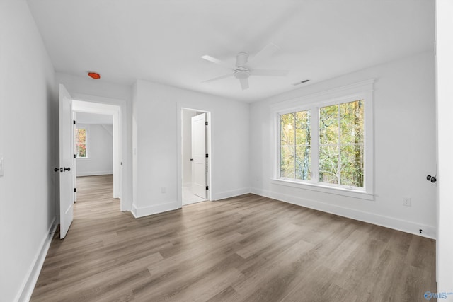 unfurnished room with light hardwood / wood-style floors and ceiling fan