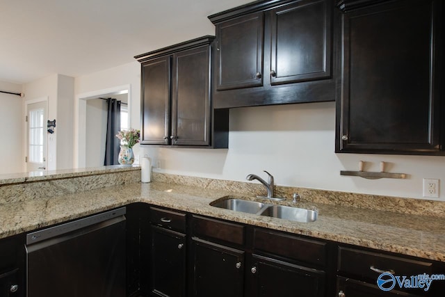 kitchen with sink, light stone countertops, and dishwasher