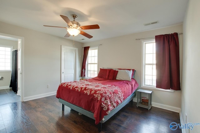 bedroom with dark hardwood / wood-style floors and ceiling fan