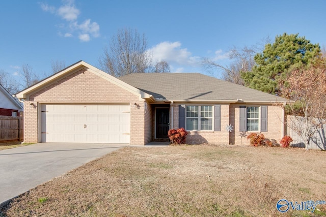 ranch-style house featuring a garage and a front lawn