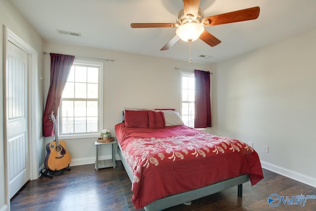 bedroom featuring dark hardwood / wood-style floors and ceiling fan