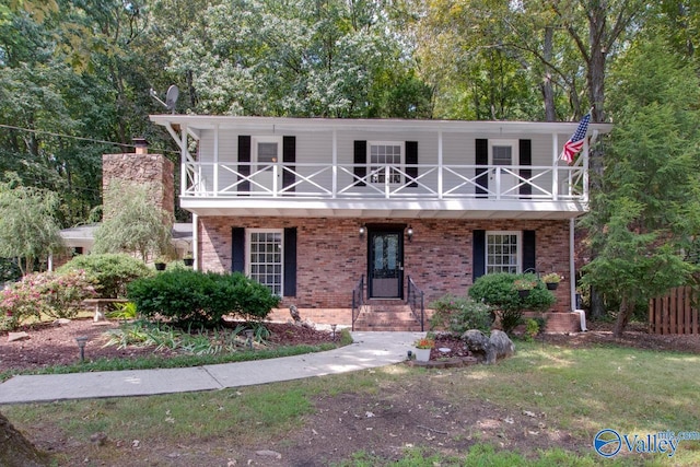 view of front of house featuring a balcony